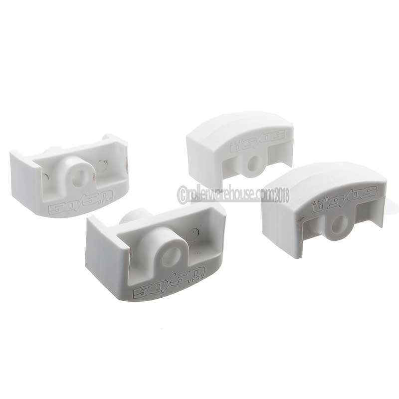 Four white plastic inline aggressive frame inserts on a white background