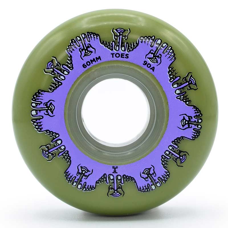 Close up face shot of a green urethane aggressive inline skate wheel with a purple graphic depicting toes with text that reads "60mm toes 90a". The wheel is featured against a white background.