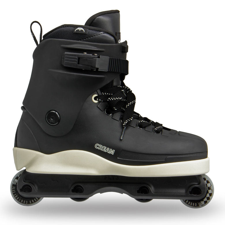 A black inline skate boot with a cream-colored midsole and black wheels, shown from a side profile on a white background.