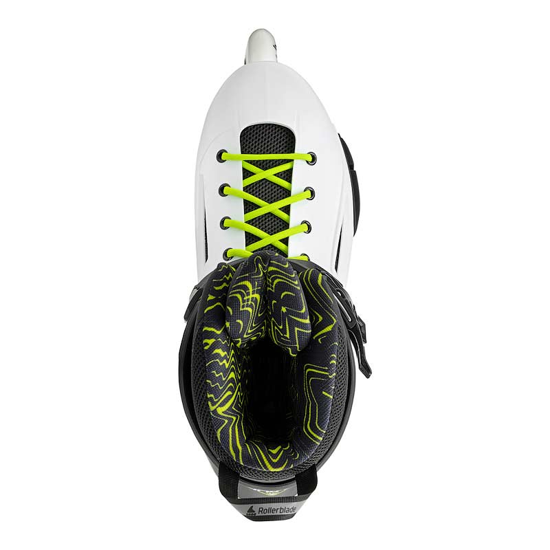 Top view of a black and white inline Rollerblade skate with yellow accents on a white background