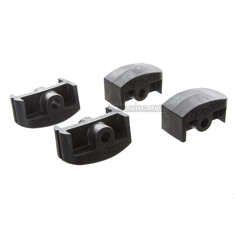 Four black plastic inline aggressive frame inserts on a white background