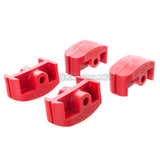 Four red plastic inline aggressive skate frame inserts on a white background