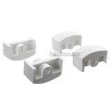 Four white plastic inline aggressive frame inserts on a white background