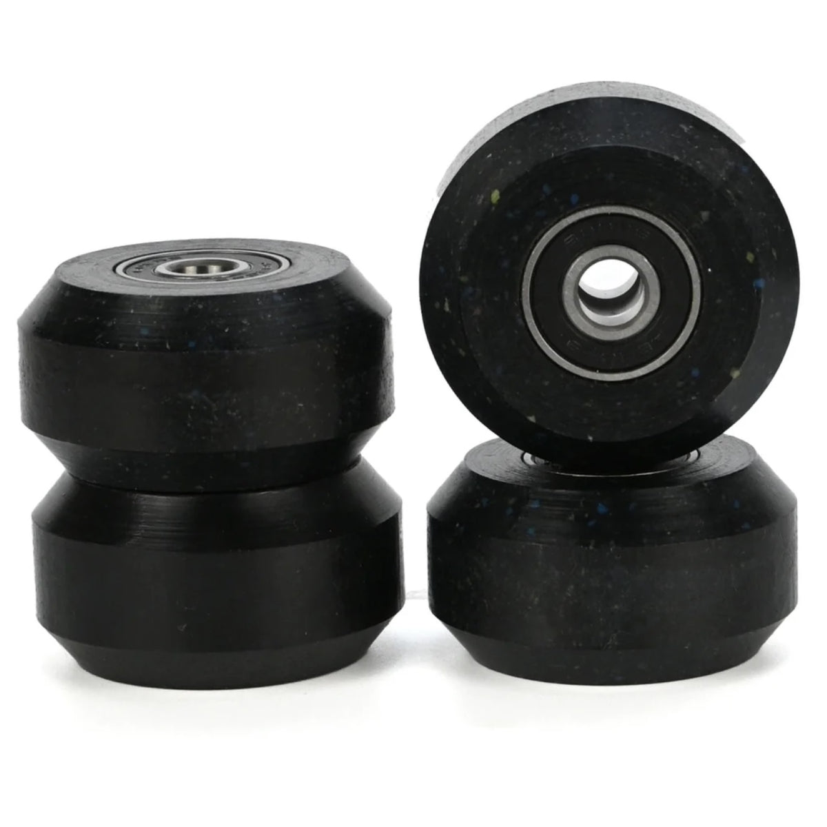 4 black aggressive inline skating anti rocker wheels with black bearings inside them. there are 2 stacked in the left of the image and 2 stacked on the right. the background is white.