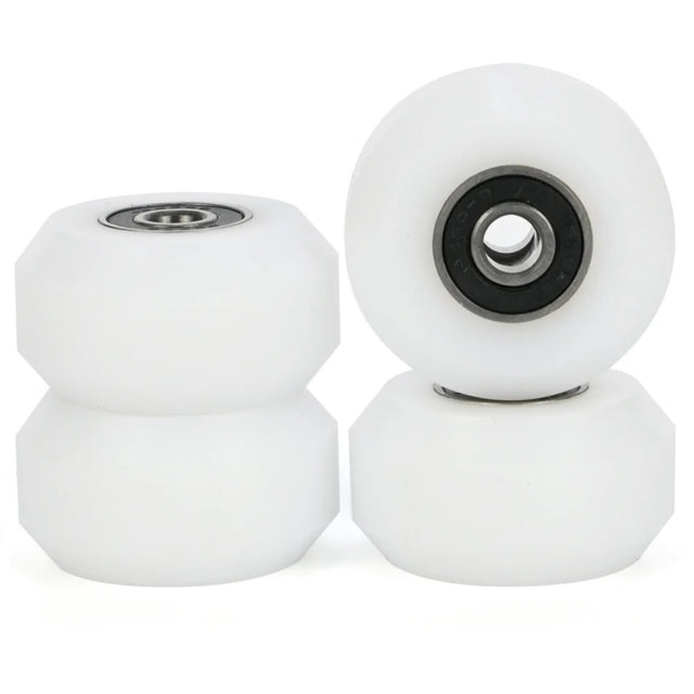 Four aggressive inline skating anti rocker wheels with bearings installed. The wheels are white and the bearings have a black shield with a metal rim on the inner and outer part of the bearing. The background is white.