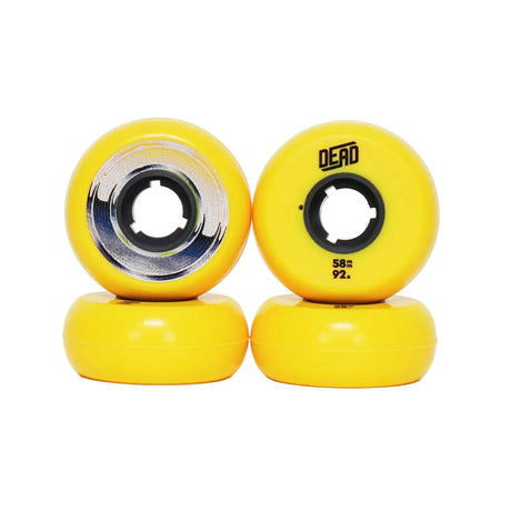 Four bright yellow skate wheels stacked in two pairs, with one wheel showing the inner core and the other showing the outer edge with the brand name 'DEAD' and size markings.