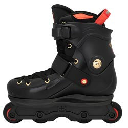 A black inline skate boot with red accents, gold hardware, and black wheels, shown from a side profile on a white background.