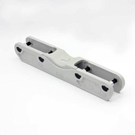 A light grey aggressive inline skate frame with black hardware on a white background.