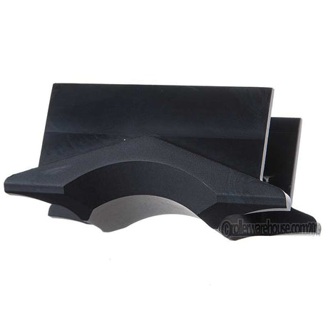 A close up image of a black metal aggressive skate part called an H Block. The piece of metal has many corners and grooves that are specific to the part. It is featured against a white background.