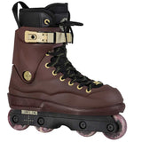 A single inline skate boot in dark brown leather with black laces, gold-tone hardware, and a black baseplate with pink-tinted wheels, shown on a plain white background.