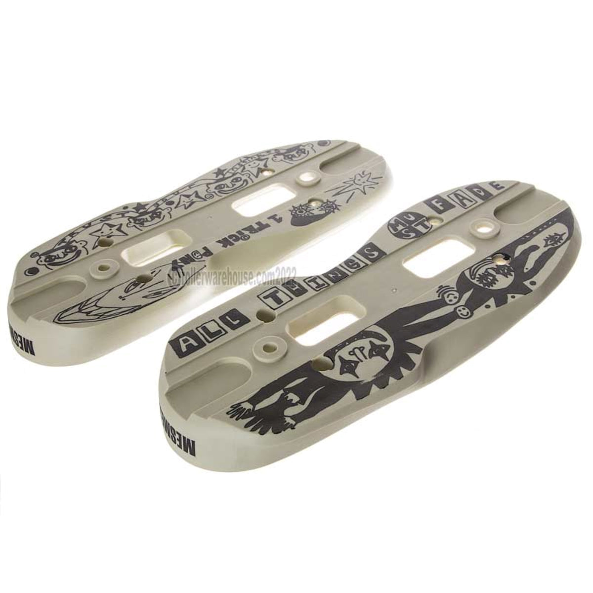 Two cream or sand colored aggressive inline skate parts called soul plates with a black graphic and screw holes milled into them. they are featured on a white background.