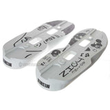 Two white aggressive inline skate parts called soul plates with a black graphic and screw holes milled into them. they are featured on a white background.