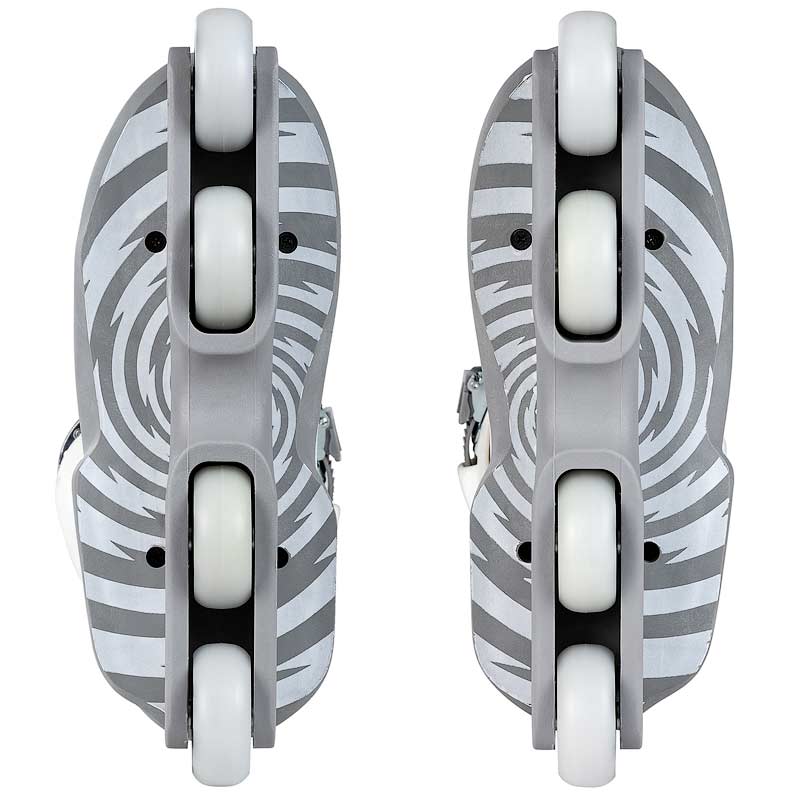 A pair of inline skates shown from the bottom, featuring gray and white zebra-stripe patterned decks with white wheels and gray footbeds.
