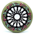 A single Inline skate wheel in green with black spokes and core. The wheel features a pink and light blue graphic with small text that reads "doses" "110mm" and "87a". The wheel is featured on a white background.
