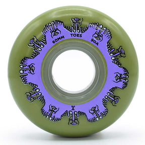 Close up face shot of a green urethane aggressive inline skate wheel with a purple graphic depicting toes with text that reads "60mm toes 90a". The wheel is featured against a white background.