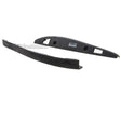 Two black plastic aggressive skate parts on a white background
