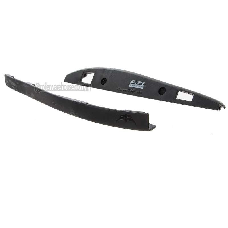 Two black plastic aggressive skate parts on a white background
