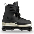A black inline skate boot with a cream-colored midsole and black wheels, shown from a side profile on a white background.