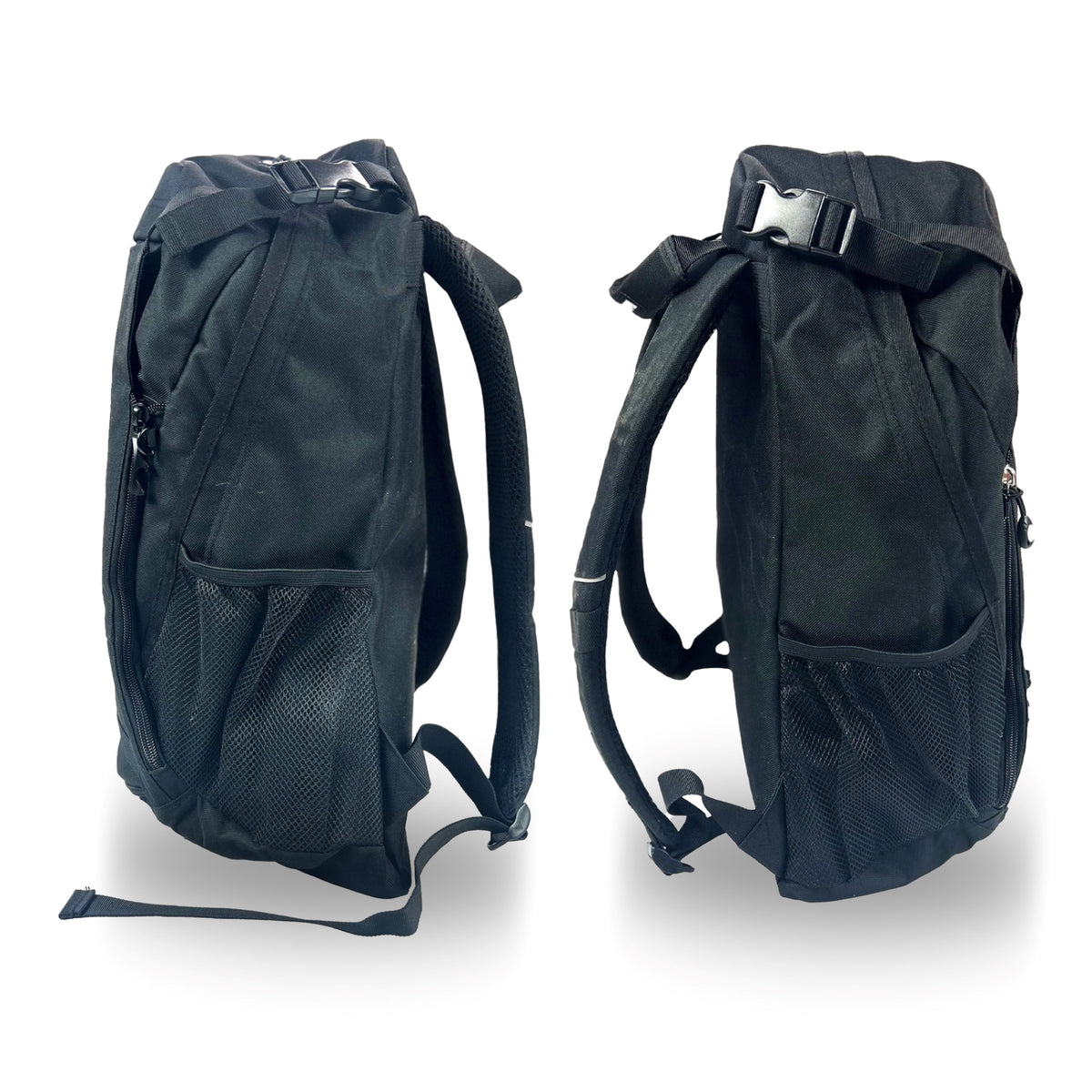 Two black canvas backpacks viewed from the side with strap and buckles as well as mesh pockets attached. The two backpacks are featured against a plain white background.