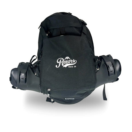 Black canvas backpack carrying two skates with the top of those skates sticking out of both sides of the backpack. The backpack is featured against a white background. 
