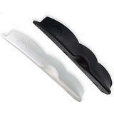 White and black plastic components on a white background