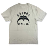 A light beige crewneck t-shirt featuring a black graphic and the text 'RAZORS SKATE CO.' on the front, displayed flat against a white background.