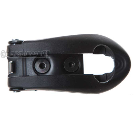 A black metal aggressive skate buckle with a matte finish, featuring a central cutout and two screw holes, shown on a plain white background.
