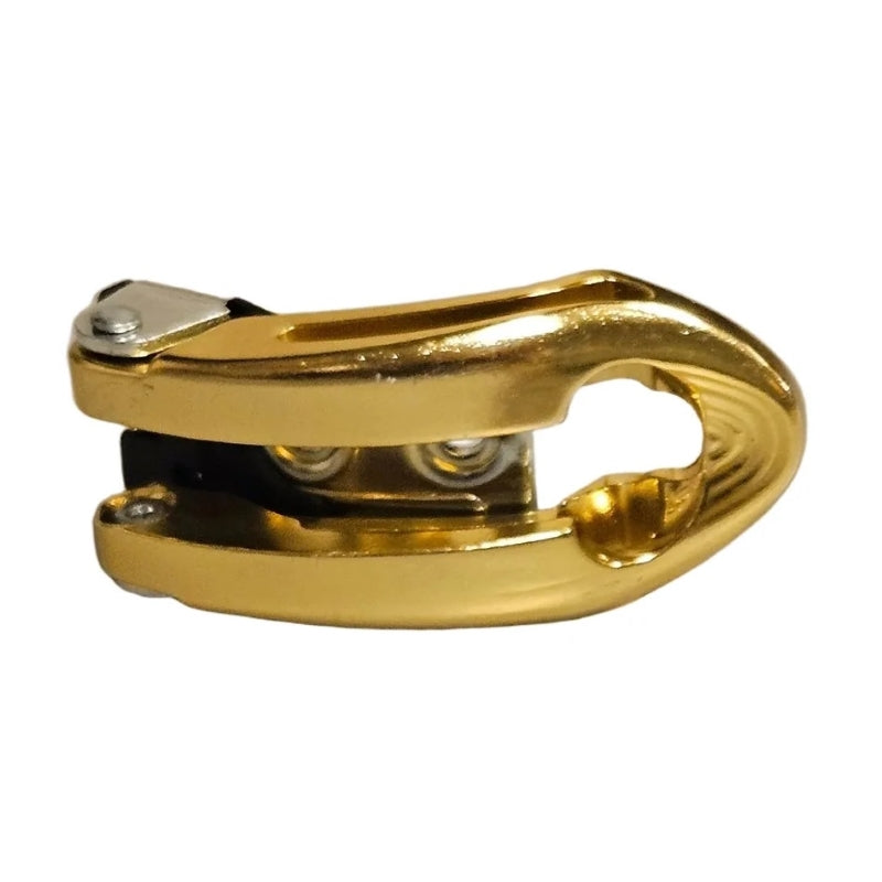 Gold-colored metal aggressive skate buckle with a polished finish, shown on a plain white background.