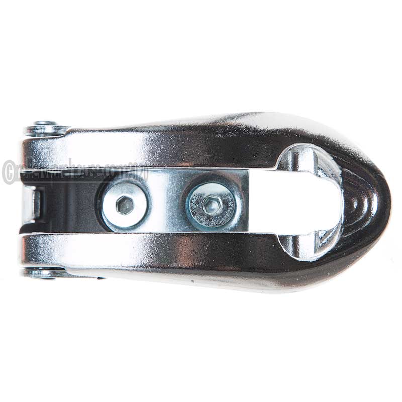 A close-up of a polished metallic aggressive skate buckle, shown on a plain white background.