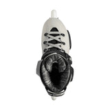 White roller skate with black accents on a white background viewed from the top.