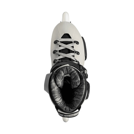 White roller skate with black accents on a white background viewed from the top.