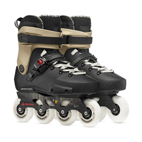 A pair of inline skates in black and beige with white wheels, shown against a plain white background.