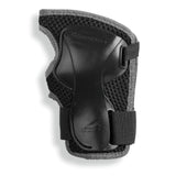 A black and gray protective wrist guard pad with a textured mesh backing and adjustable hook-and-loop straps, shown on a white background.