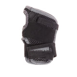 A black wrist guard with velcro straps, a stitched on patch that read "rollerblade right", mesh material and a stitched gray material border on a white background. 