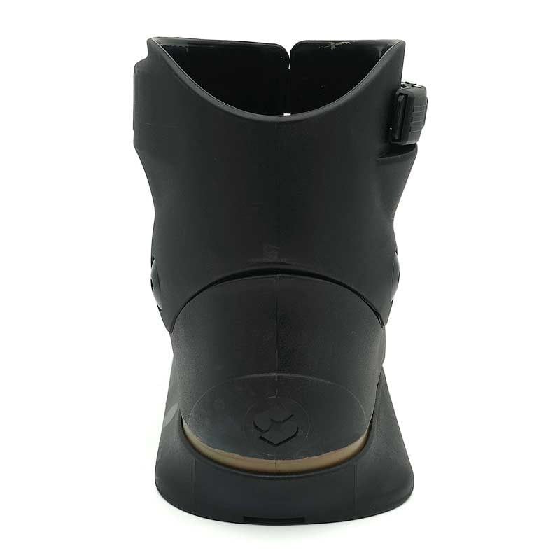 Black boot with a white sole on a white background