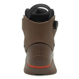 Brown ankle boot with black strap on a white background