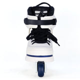 White rollerblade with black wheels on a white background