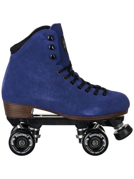 A single blue suede roller skate boot with black laces, black wheels, and a brown wooden-looking heel, shown against a plain white background.