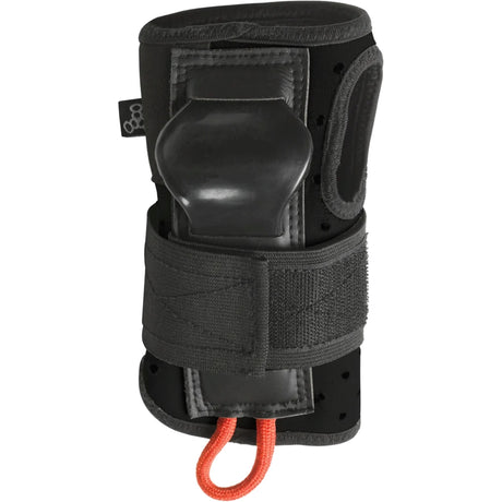 A black wrist guard pad standing straight up against a white background. The pad has an orange loop at the bottom, a brand logo tag on the side, a velcro strap wrapped around it and a plastic piece sticking out near the palm area.